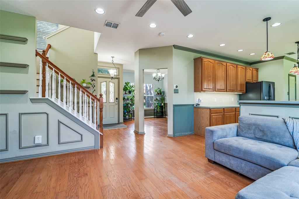 10702 Augusta Lane Rowlett, TX 75089 - Photo 7 of 25 a living room with furniture and wooden floor
