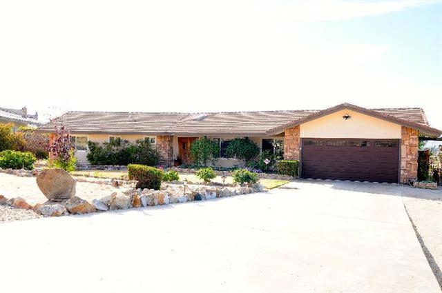 16513 Muni Road Apple Valley, CA 92307 - Photo 1 of 1 a view of a house with sitting area and furniture