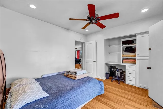 a living room with furniture and a ceiling fan