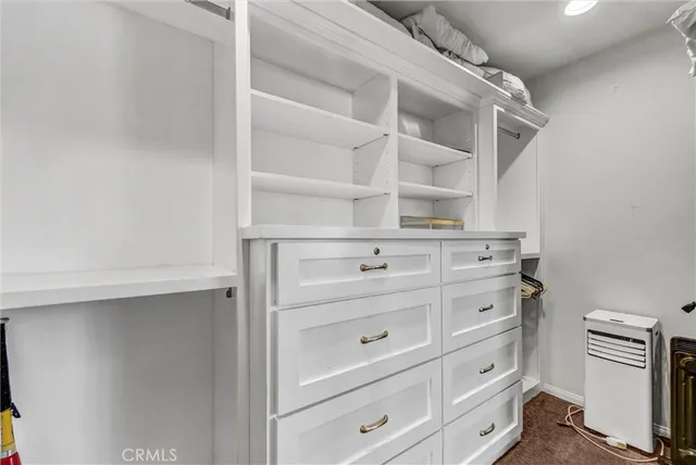 a view of an empty walk in closet