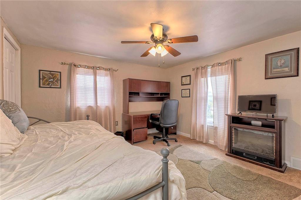 8002 Hayward Street Irwin, PA 15642 - Photo 19 of 31 a bedroom with a bed and a television