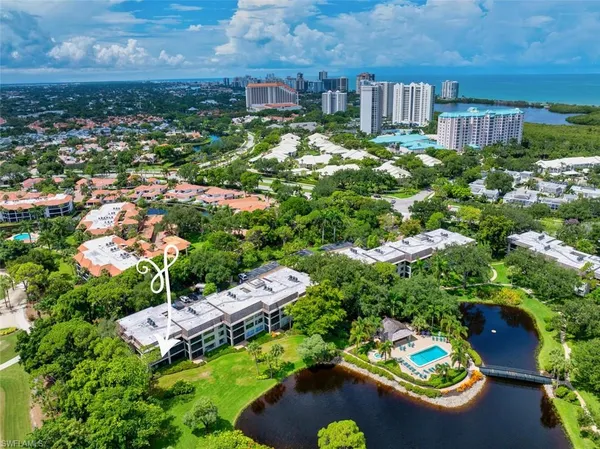 an aerial view of a house with yard swimming pool and outdoor seating