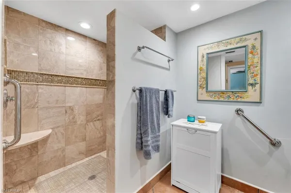 a bathroom with a bathtub and a shower