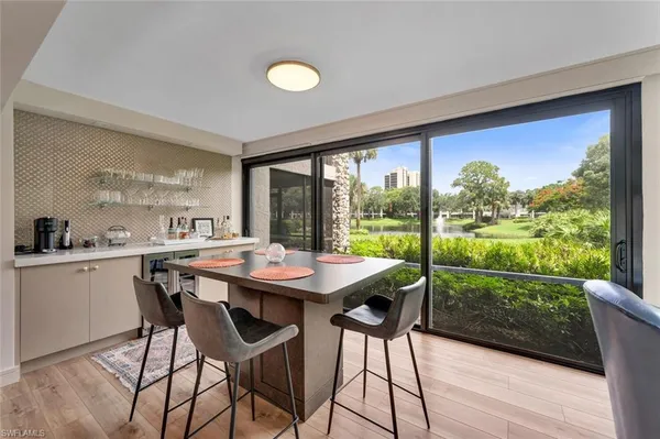 a view of a dining room with furniture window and outside view