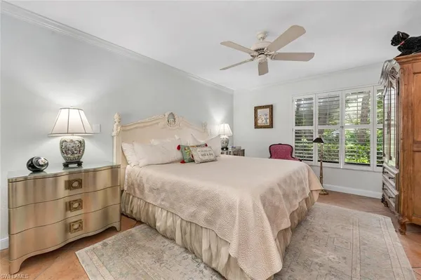 a bed room with a bed and a window