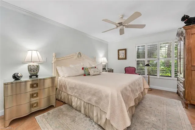 a bed room with a bed and a window