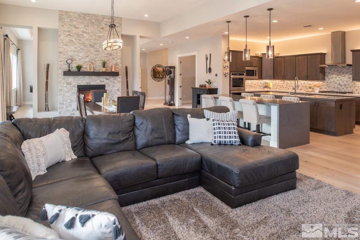 3012 Feathertop Drive Reno, NV 89521 - Photo 11 of 40 a living room with furniture kitchen view and a chandelier