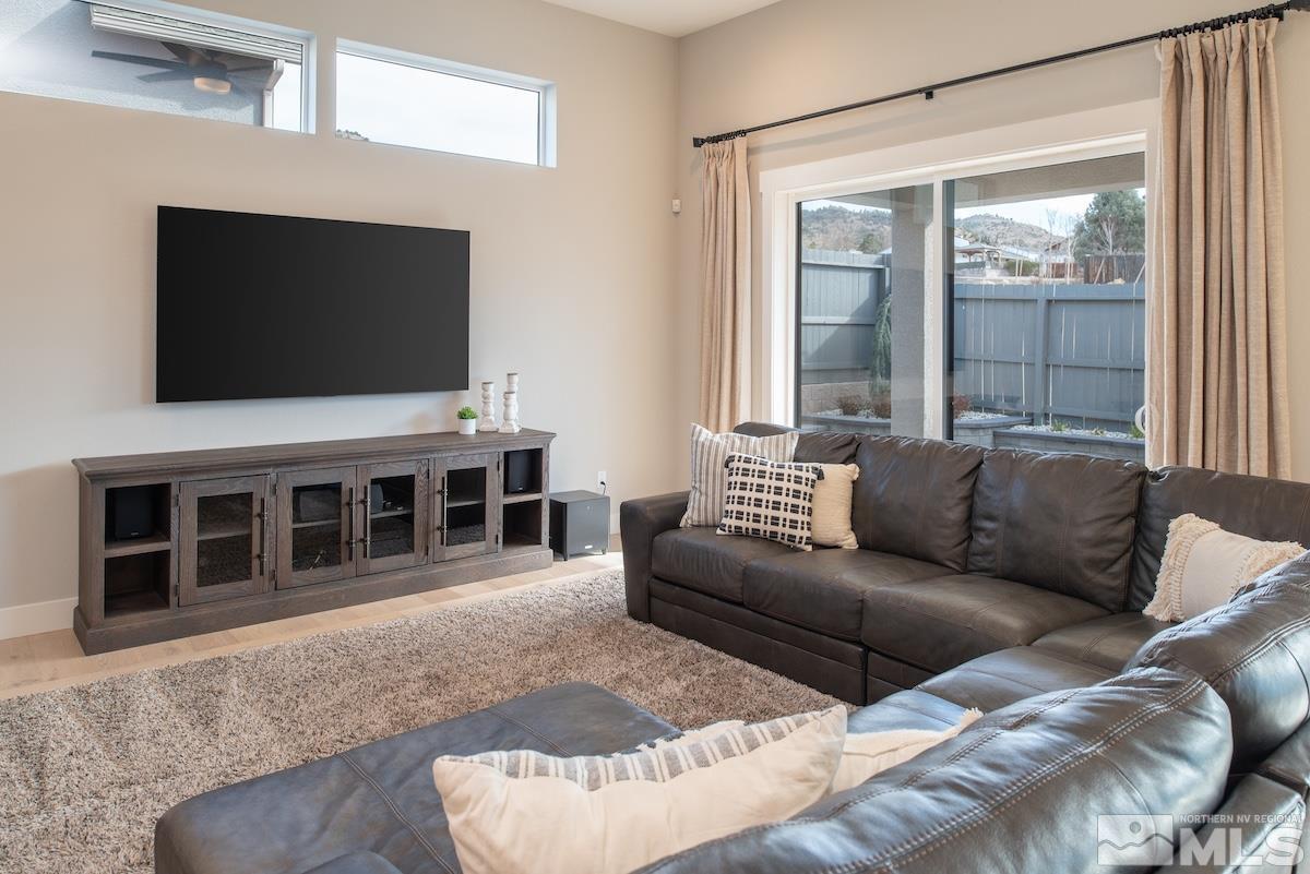3012 Feathertop Drive Reno, NV 89521 - Photo 12 of 40 a living room with furniture and a flat screen tv