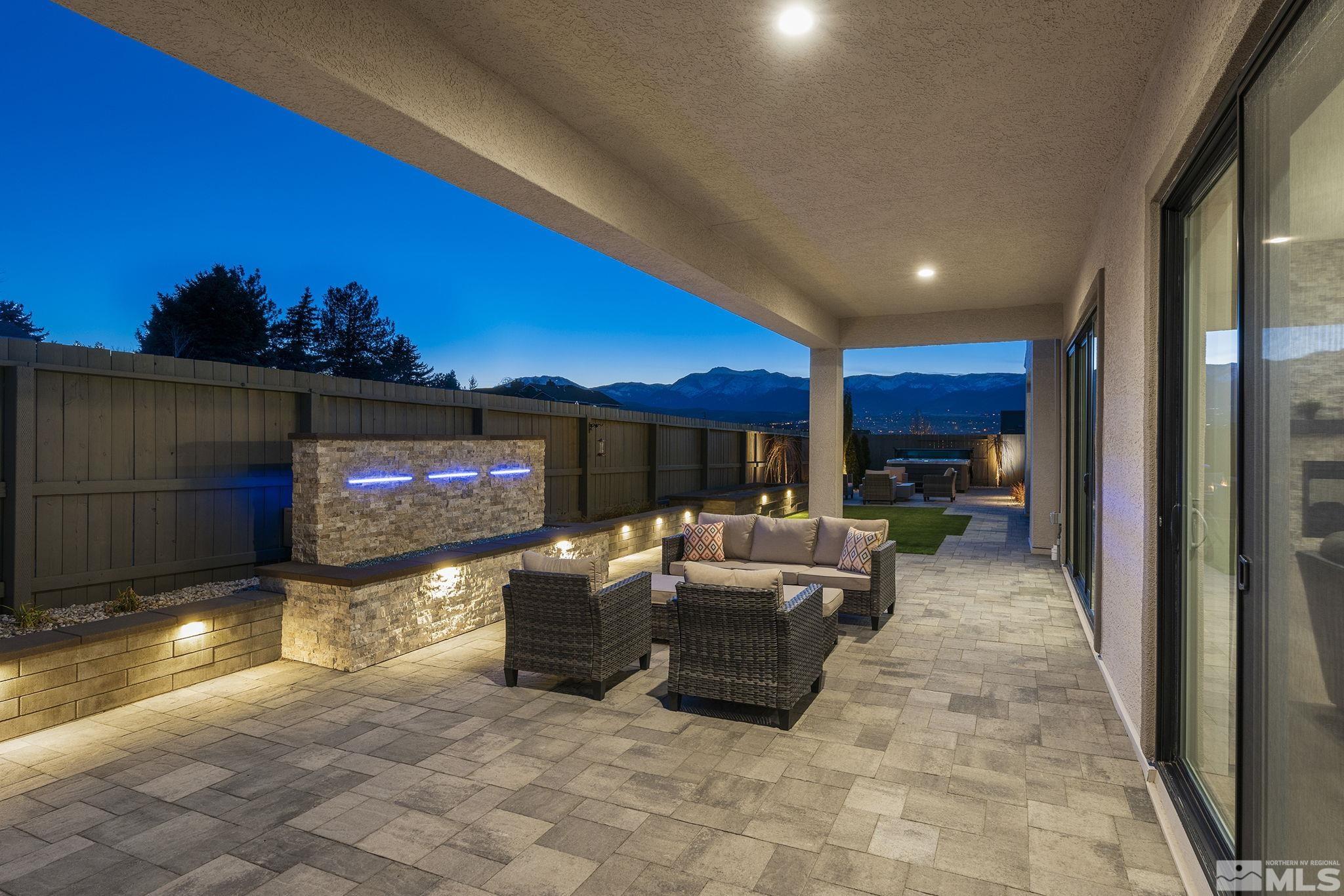 3012 Feathertop Drive Reno, NV 89521 - Photo 16 of 40 a view of a livingroom with furniture and a flat screen tv
