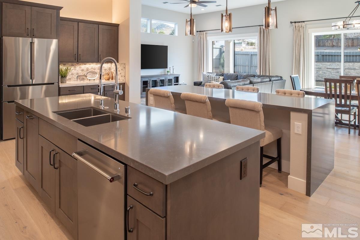 3012 Feathertop Drive Reno, NV 89521 - Photo 2 of 40 a kitchen with a stove a sink and a refrigerator