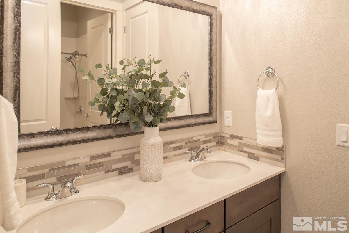 3012 Feathertop Drive Reno, NV 89521 - Photo 30 of 40 a bathroom with a sink and a mirror