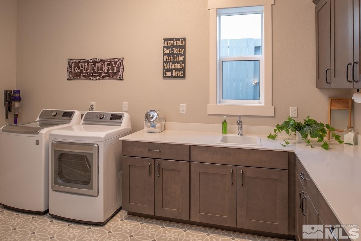 3012 Feathertop Drive Reno, NV 89521 - Photo 31 of 40 a utility room with sink dryer and washer
