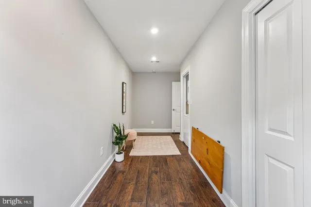 a balcony with furniture and floor to ceiling windows