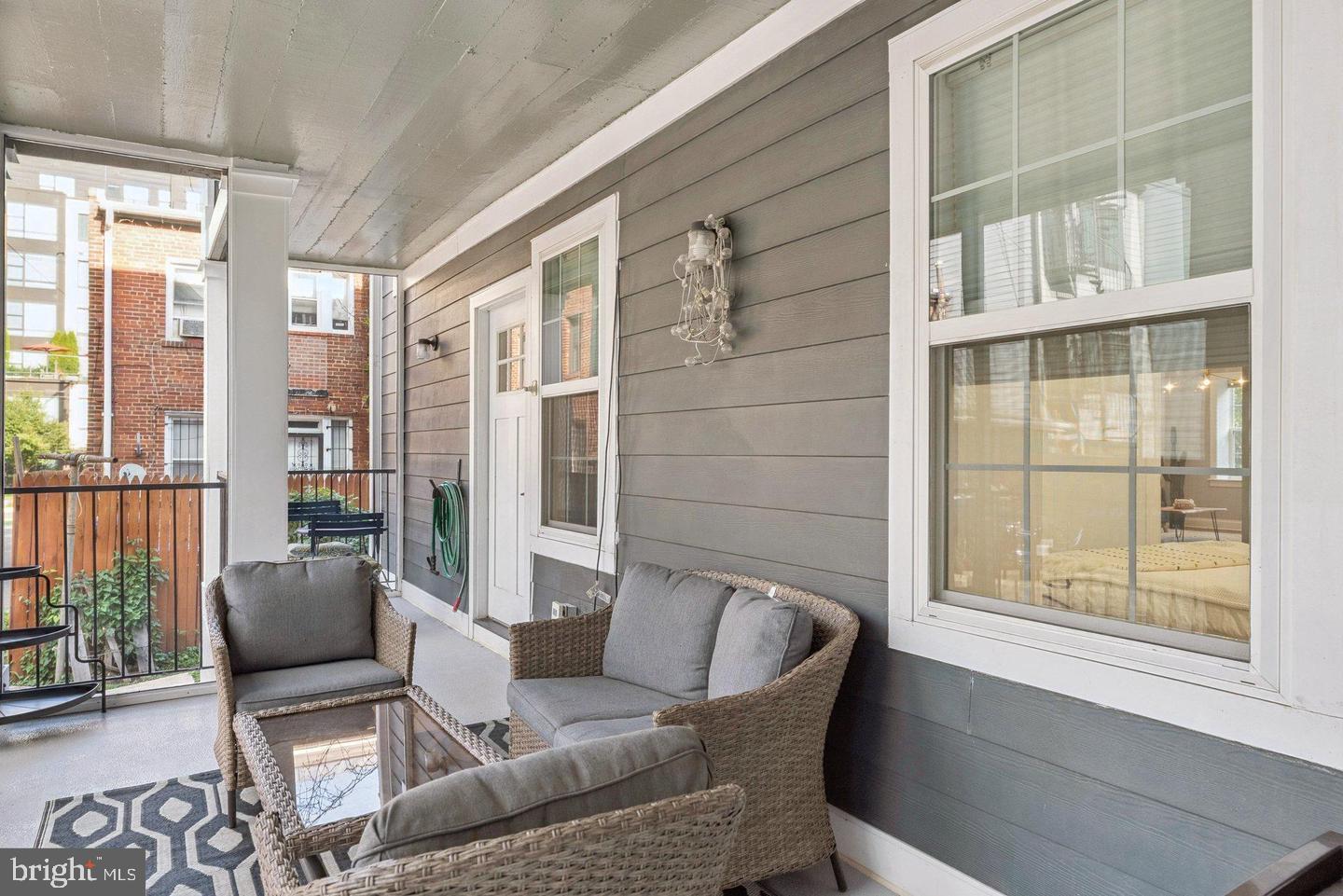 718 Jackson Street Northeast, Unit 1 Washington, DC 20017 - Photo 20 of 22 a living room with furniture and a window