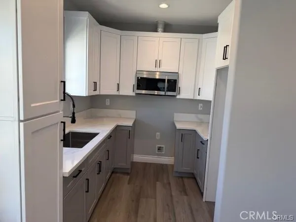 a kitchen with a sink and cabinets