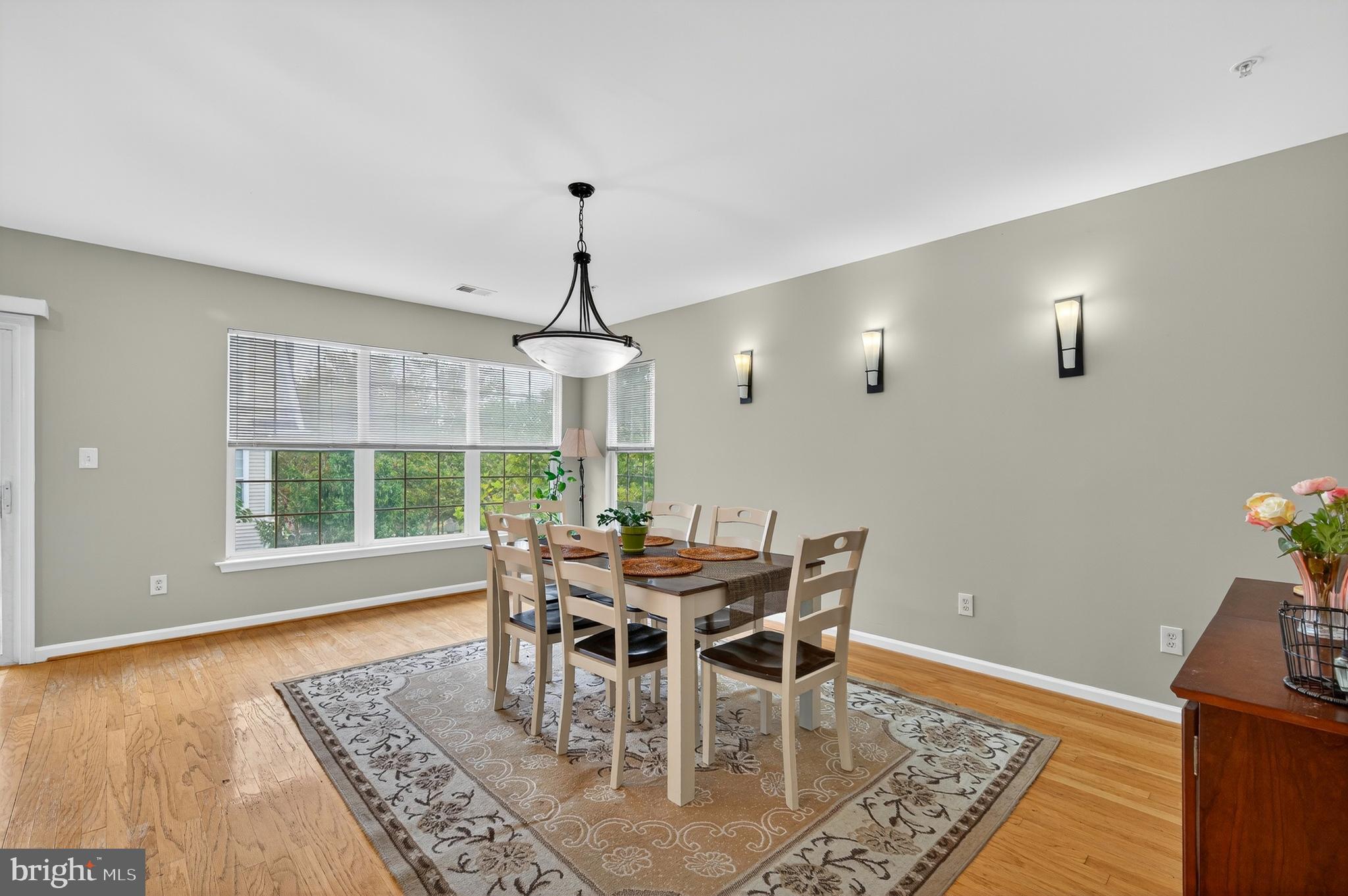 2046 University Boulevard West, Unit 12 Silver Spring, MD 20902 - Photo 15 of 64 a view of a dining room with furniture window and outside view