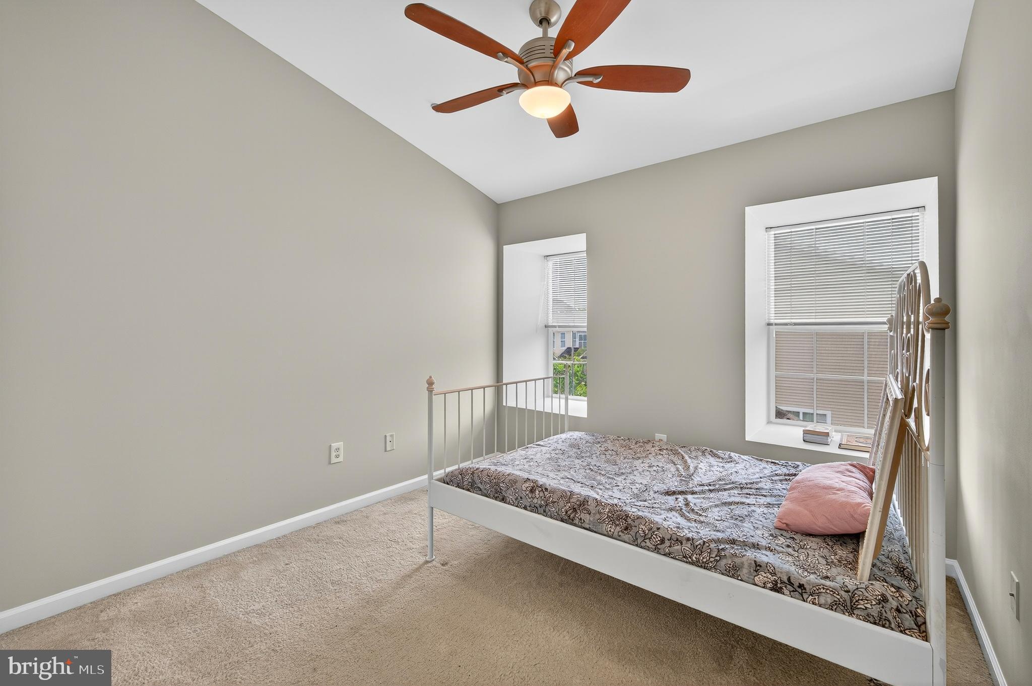 2046 University Boulevard West, Unit 12 Silver Spring, MD 20902 - Photo 26 of 64 a bedroom with a bed and a window