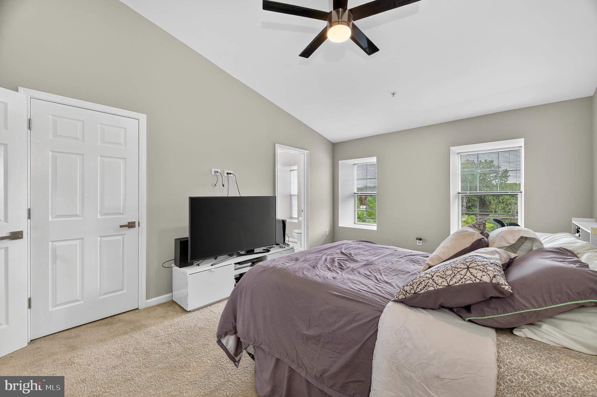 2046 University Boulevard West, Unit 12 Silver Spring, MD 20902 - Photo 30 of 64 a bed room with a bed tv and a window