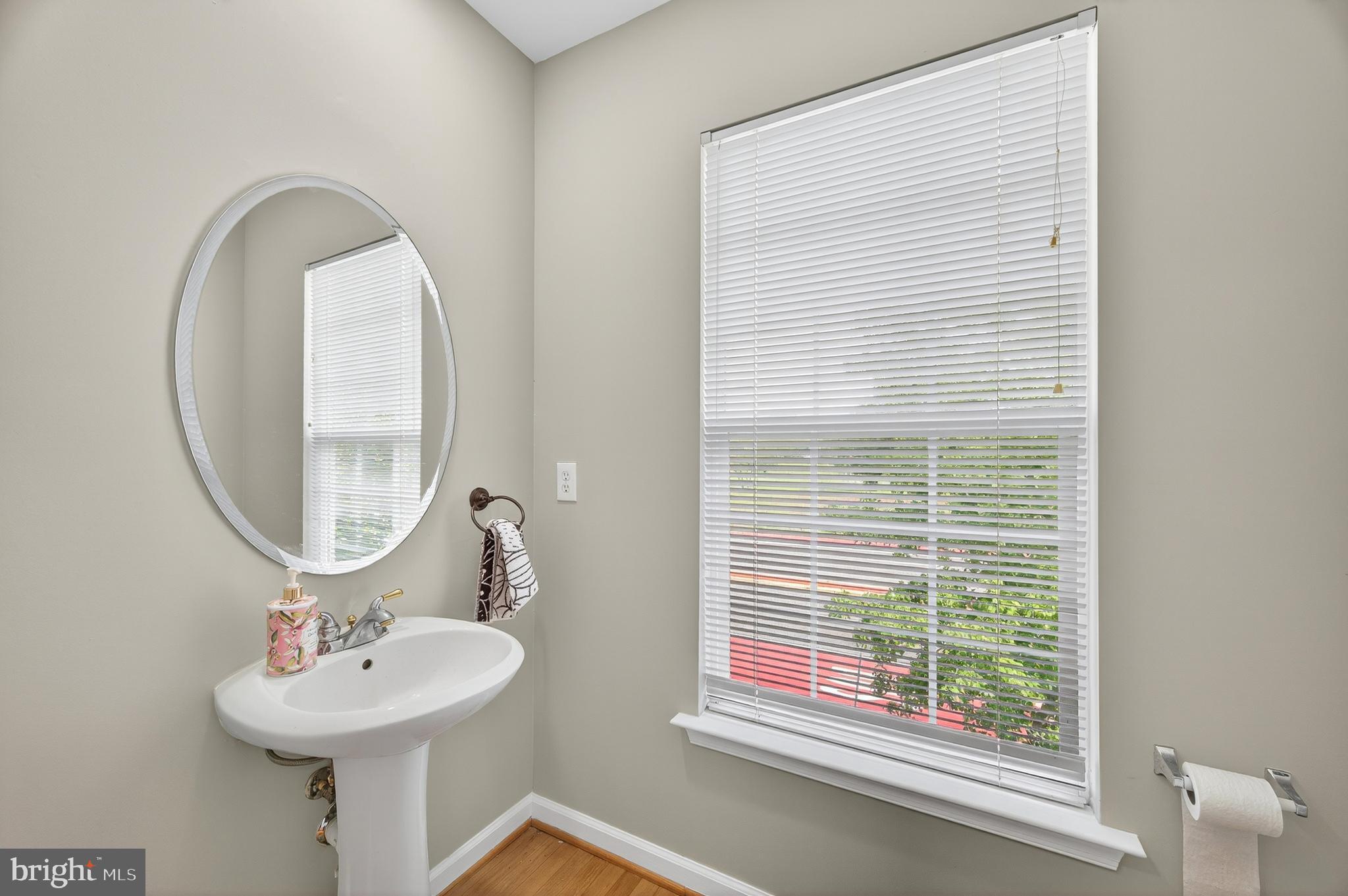 2046 University Boulevard West, Unit 12 Silver Spring, MD 20902 - Photo 34 of 64 a bathroom with a sink and a mirror