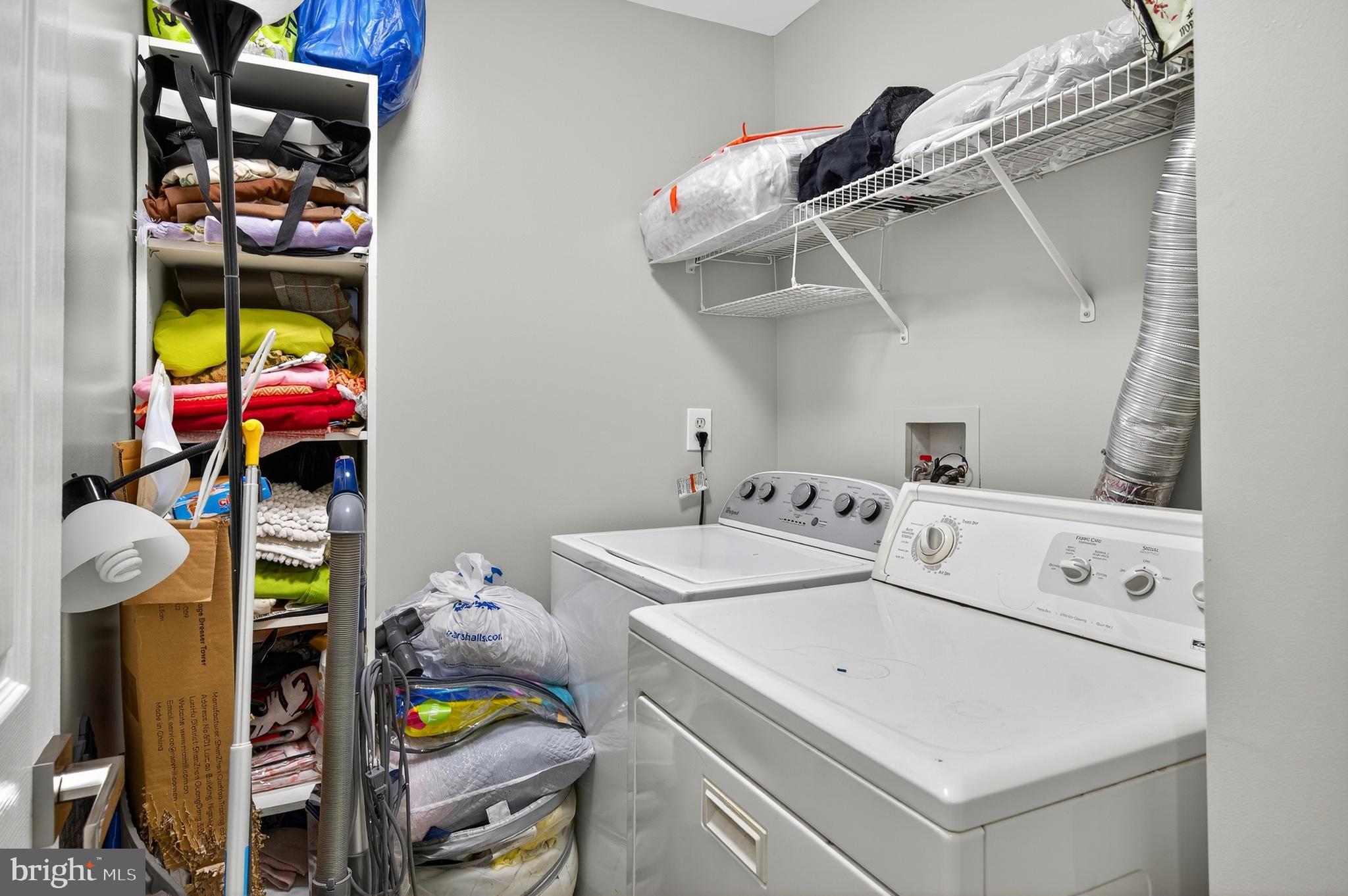 2046 University Boulevard West, Unit 12 Silver Spring, MD 20902 - Photo 37 of 64 a utility room with dryer and washer