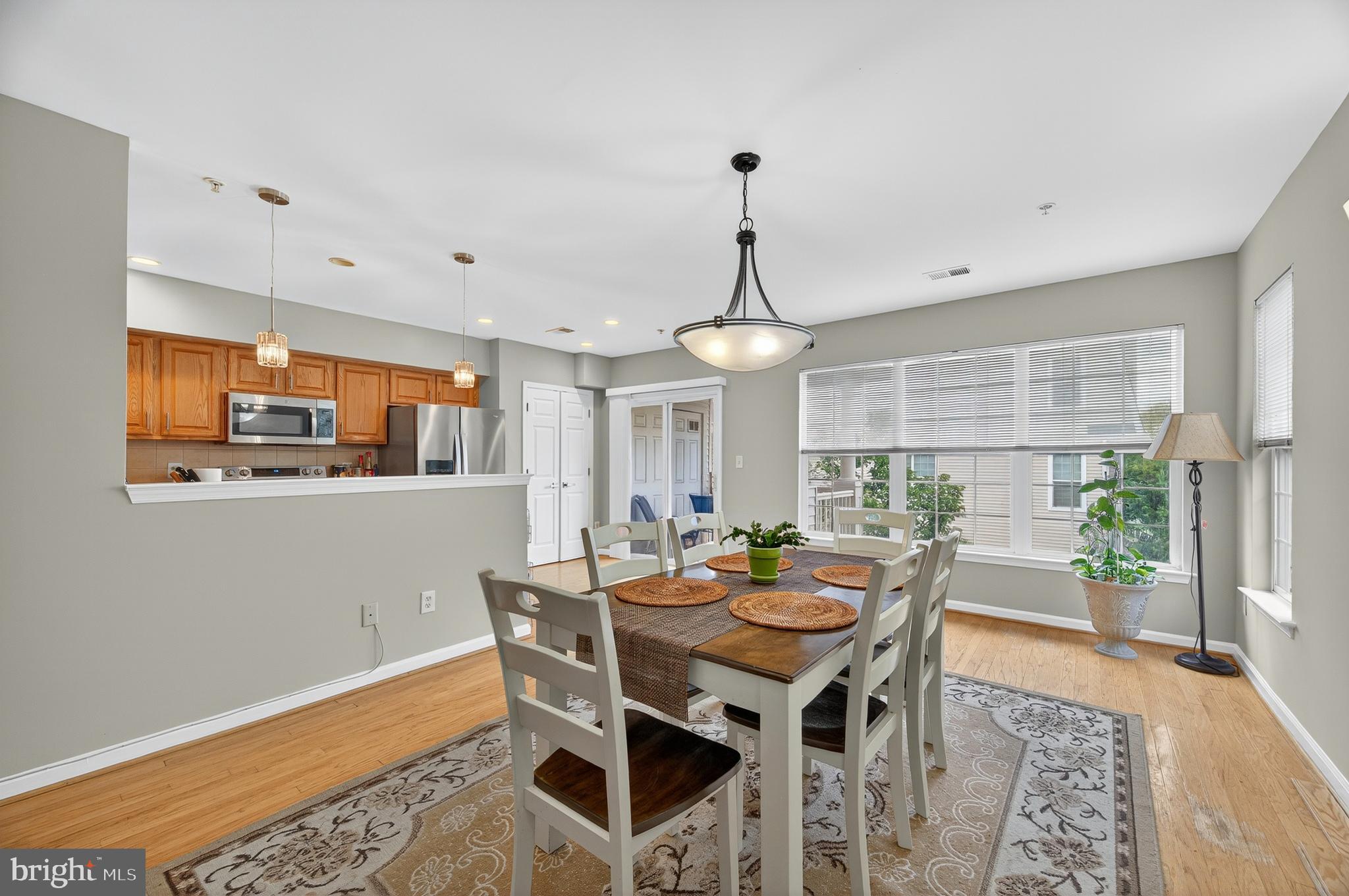 2046 University Boulevard West, Unit 12 Silver Spring, MD 20902 - Photo 4 of 64 a view of a dining room with furniture window and outside view