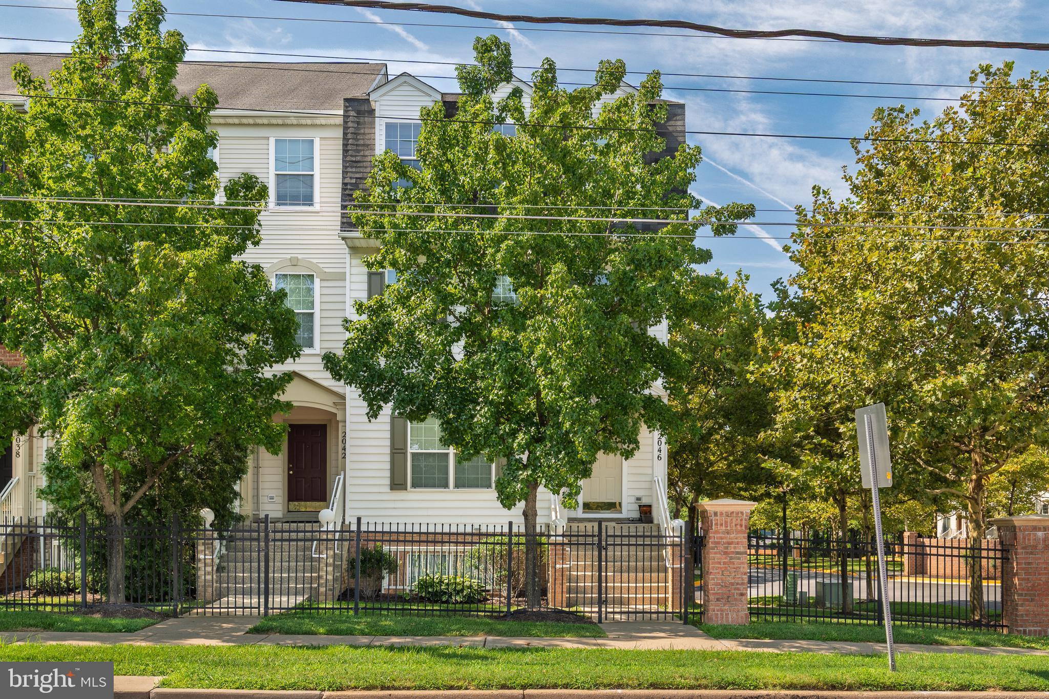 2046 University Boulevard West, Unit 12 Silver Spring, MD 20902 - Photo 43 of 64 a front view of a house with a garden