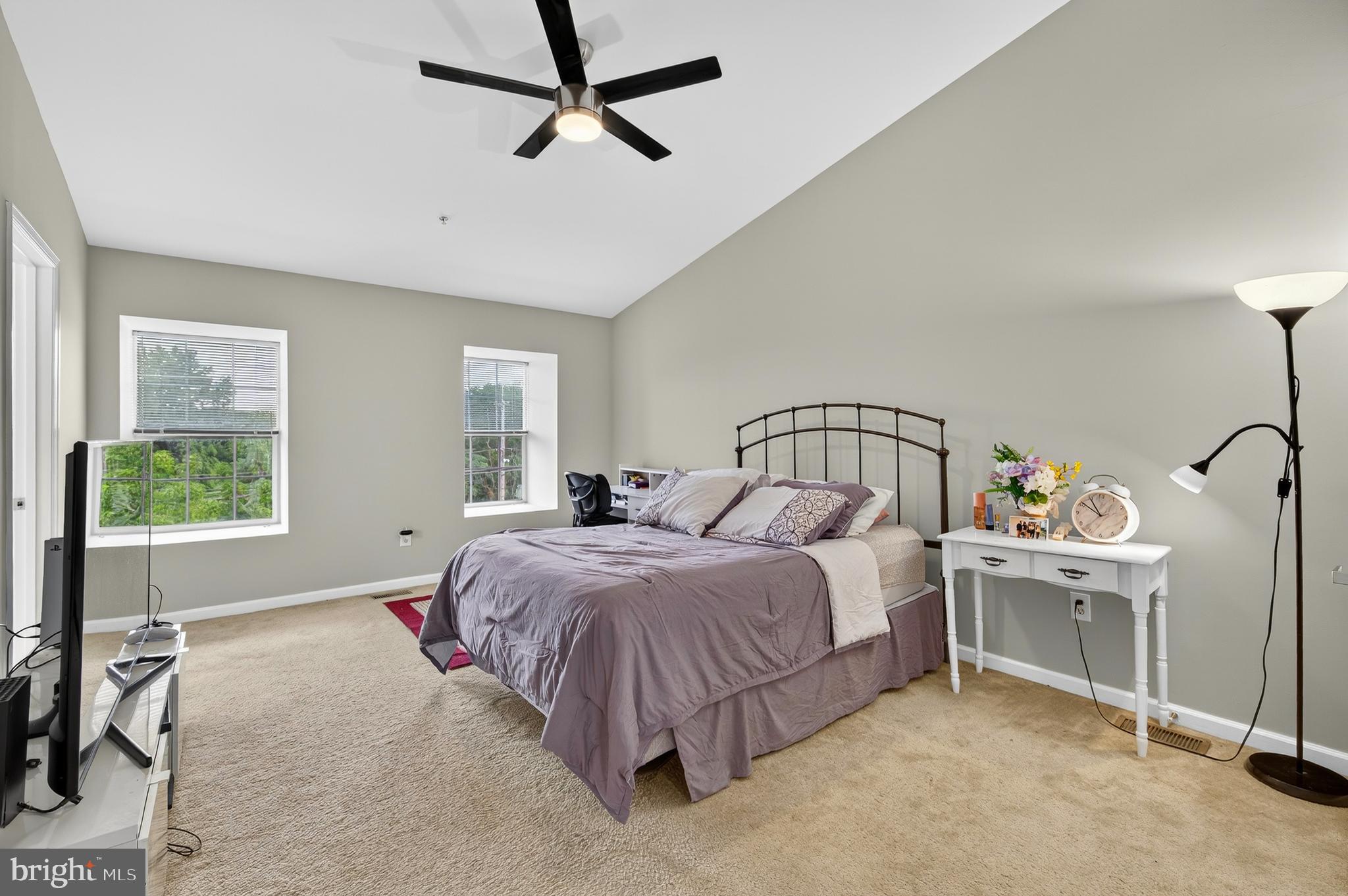 2046 University Boulevard West, Unit 12 Silver Spring, MD 20902 - Photo 5 of 64 a bed room with a bed and a window