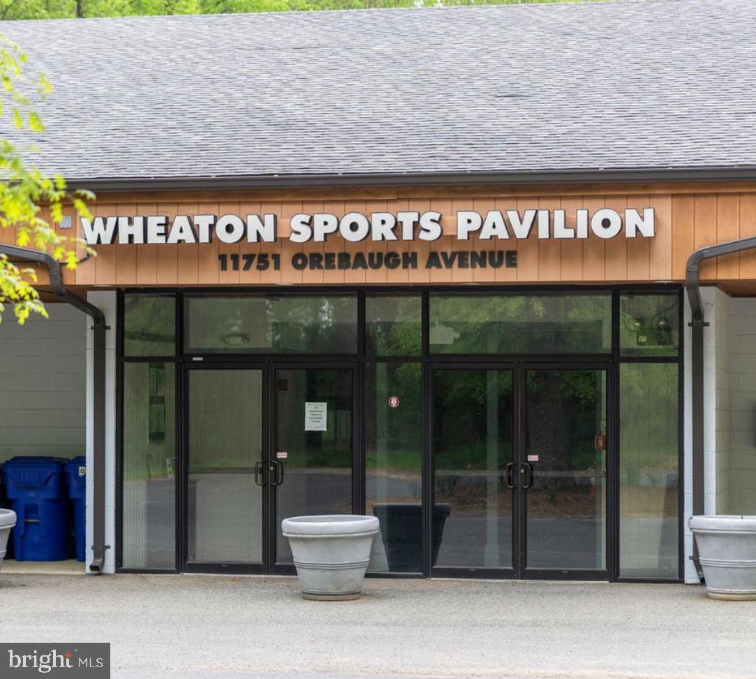 2046 University Boulevard West, Unit 12 Silver Spring, MD 20902 - Photo 56 of 64 a sign that is sitting in front of a building