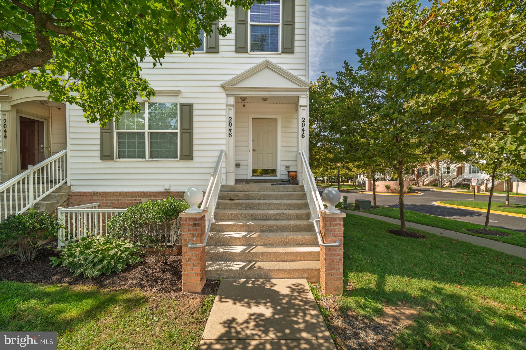 2046 University Boulevard West, Unit 12 Silver Spring, MD 20902 - Photo 8 of 64 a front view of a house with a garden
