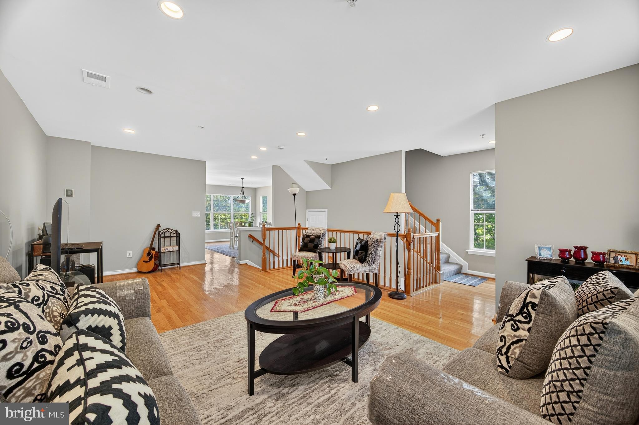 2046 University Boulevard West, Unit 12 Silver Spring, MD 20902 - Photo 10 of 64 a living room with furniture and a wooden floor