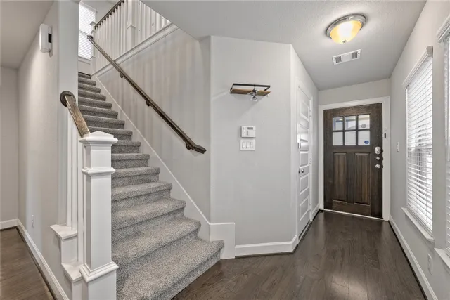 a view of entryway with wooden floor