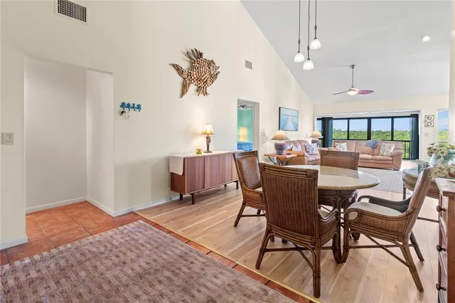 a spacious bathroom with a toilet a sink and mirror