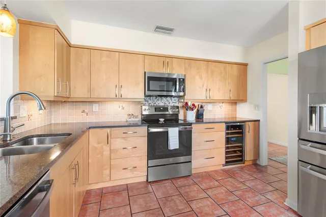 an aerial view of a houses with a yard