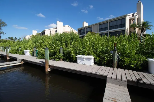 an aerial view of a house with yard swimming pool and outdoor seating