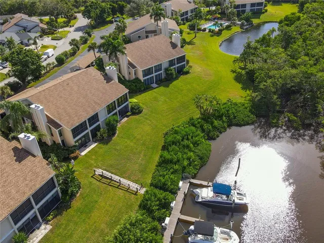 an aerial view of a house with outdoor space lake view and lake view