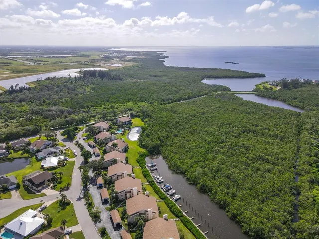 an aerial view of a house with a garden and swimming pool