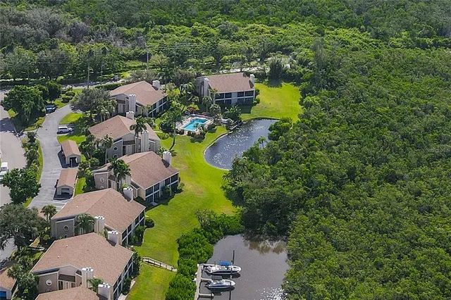 a view of a lake with a house in the background