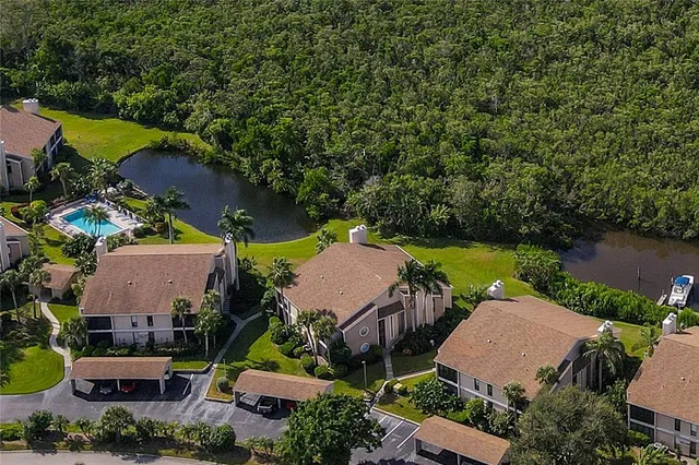a view of a house with backyard and garden