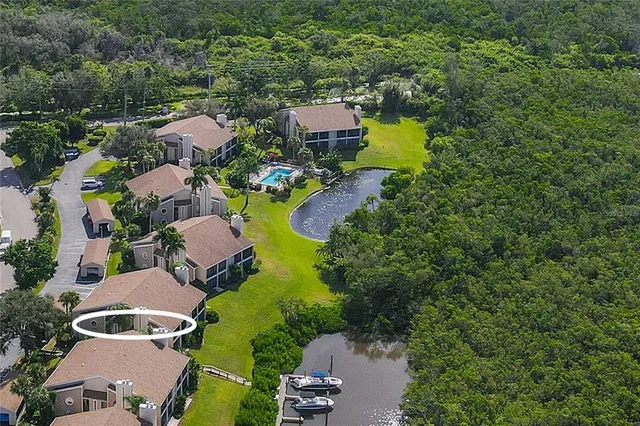 an aerial view of a house with outdoor space lake view and lake view