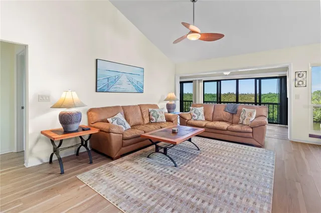 a bedroom with a large bed and a large window