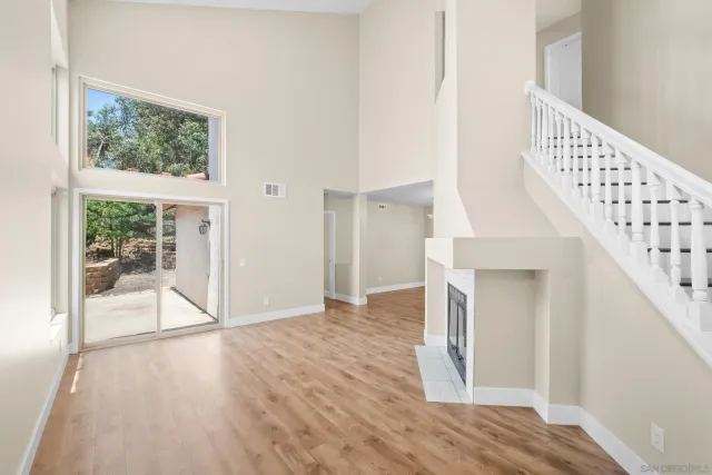 a view of entryway with wooden floor and stairs