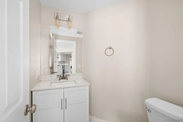 a bedroom with a bed and a desk