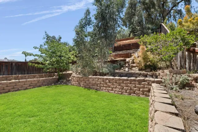 an aerial view of residential house with outdoor space and river