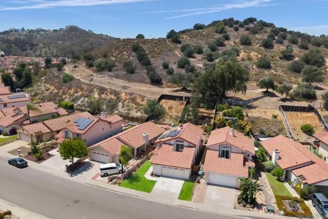 an aerial view of a house with a ocean view