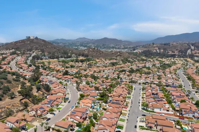 an aerial view of residential houses with outdoor space