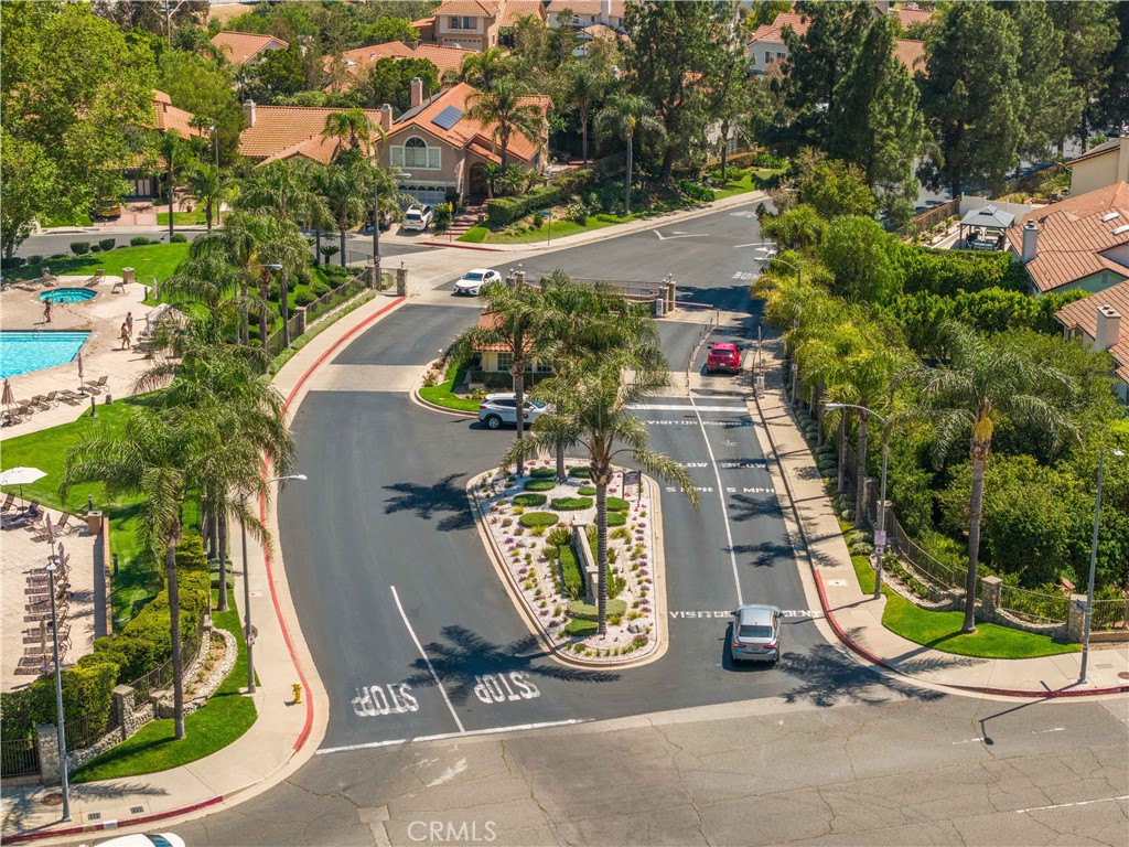 12065 Shadow Glen Lane Porter Ranch, CA 91326 - Photo 40 of 46 an aerial view of a residential houses with yard and swimming pool