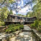 a house with trees in the background