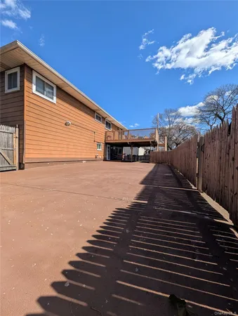 a view of a backyard of the house