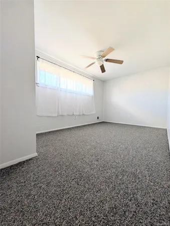 an empty room with a bathroom