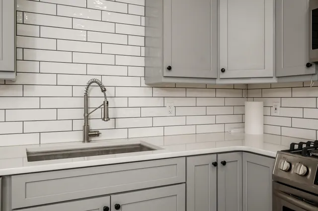 a view of a sink and cabinets